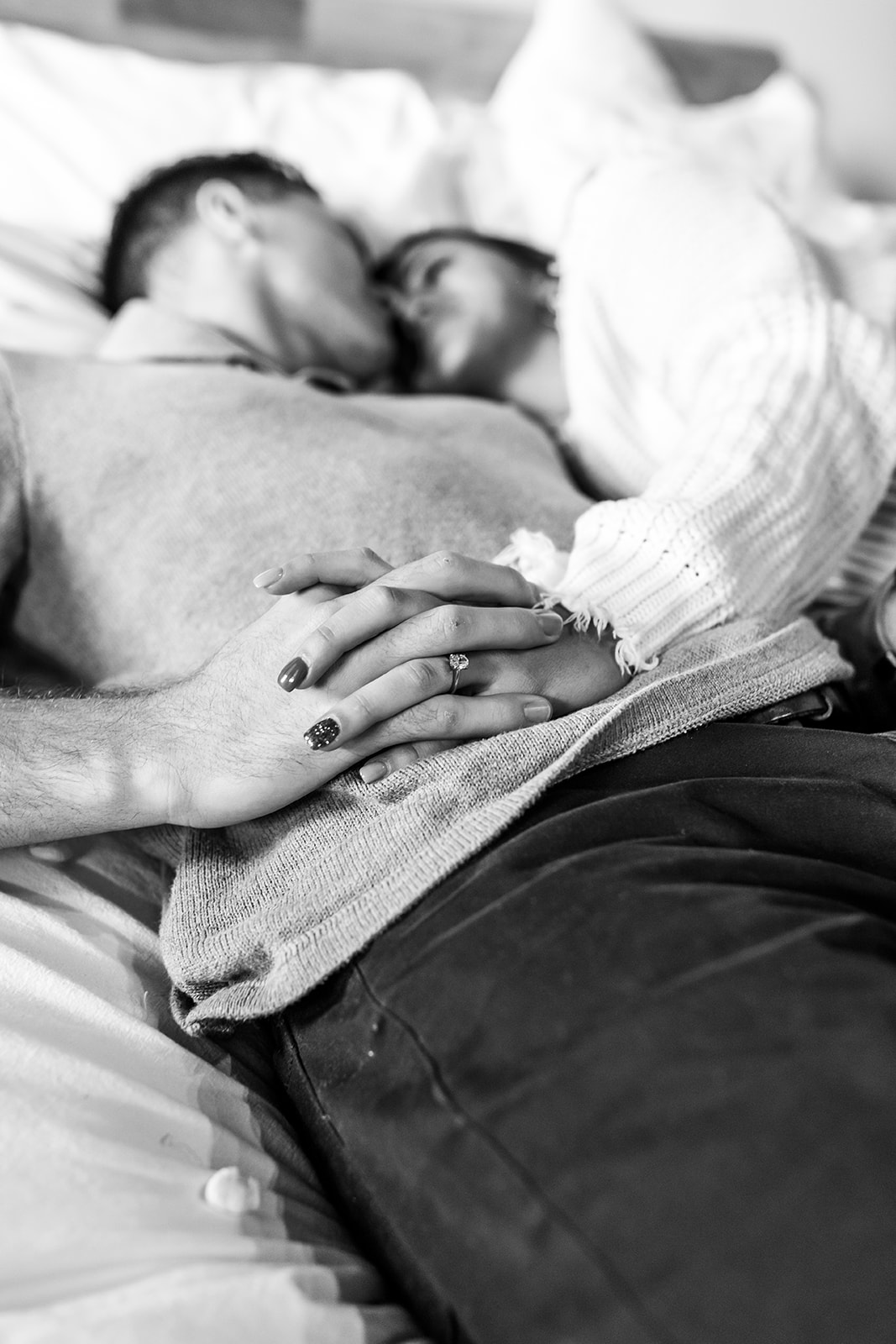 Couples Engagement Session at home black and white in bedroom cuddling
