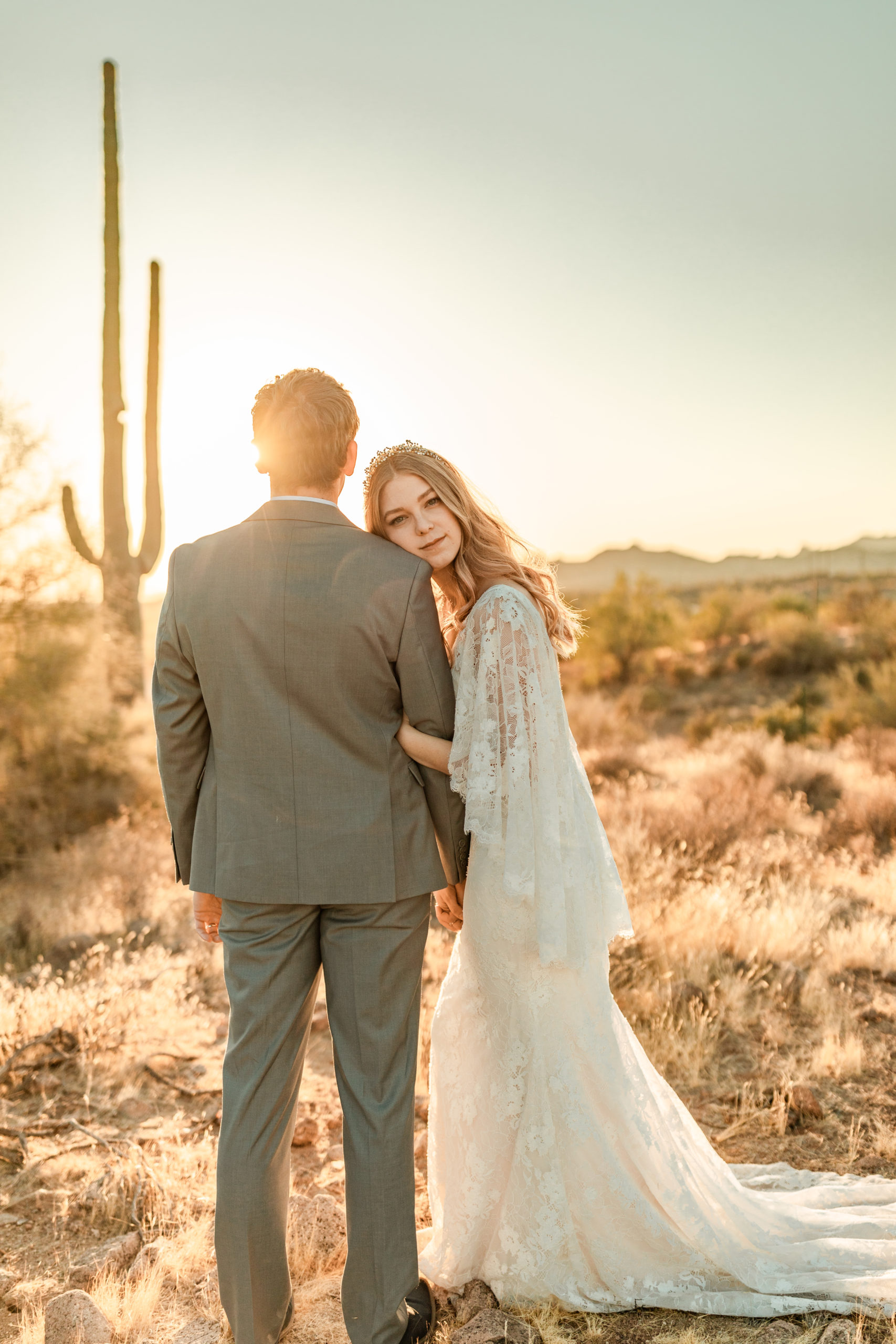 bride and groom posing in Arizona desert wedding