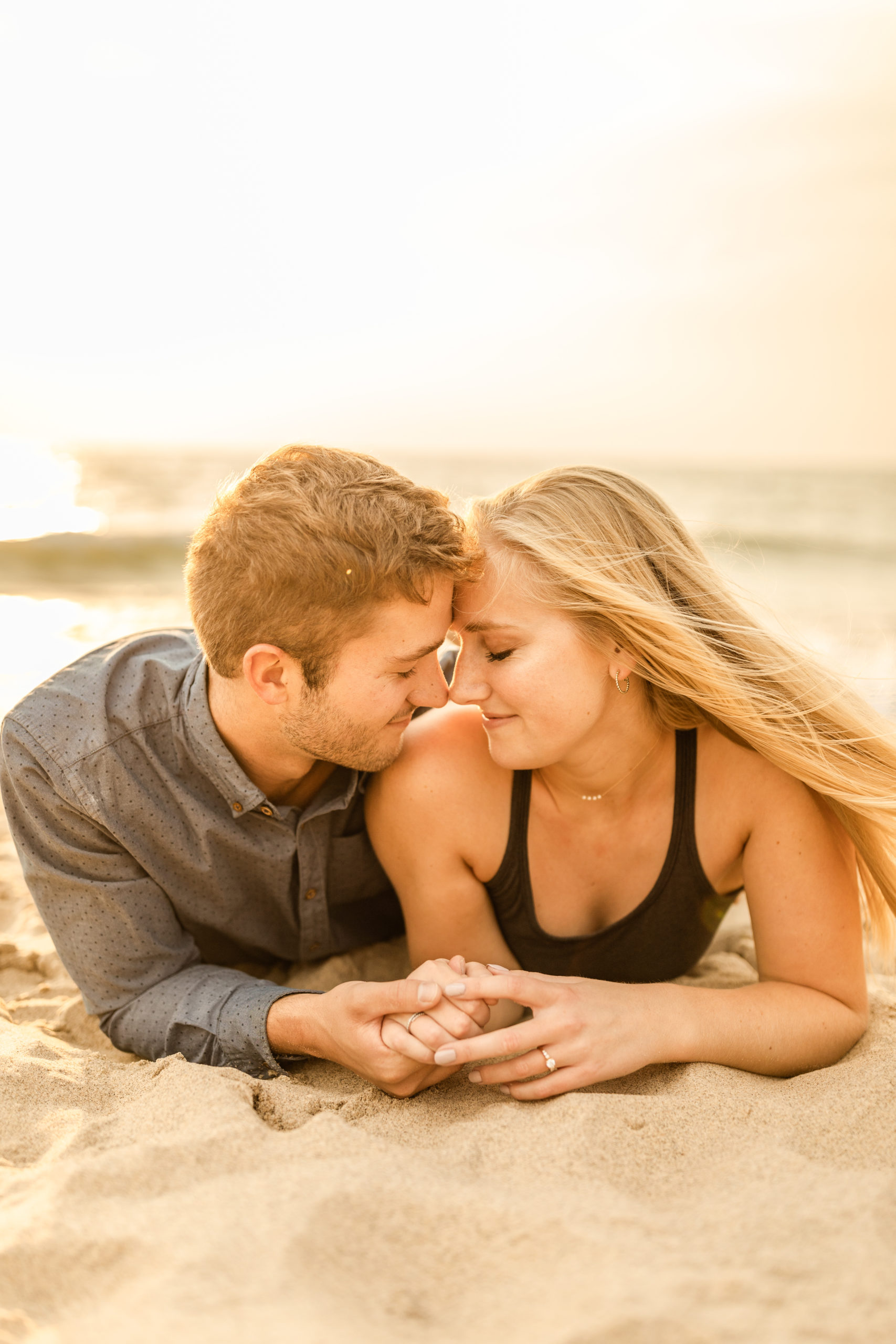 couple engagement photoshoot session at beach on Lake Michigan unique poses and ideas