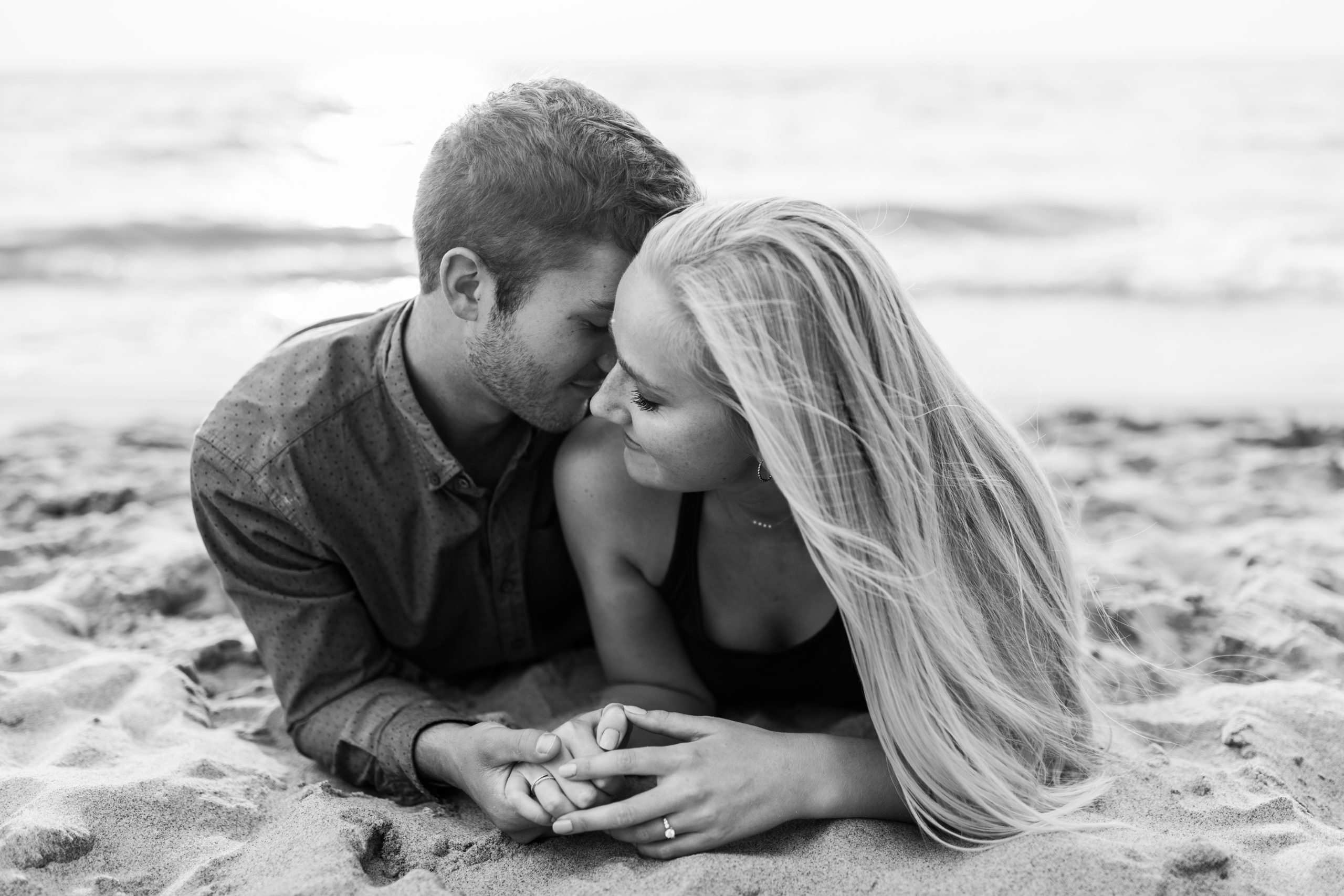 couple engagement photoshoot session at beach on Lake Michigan