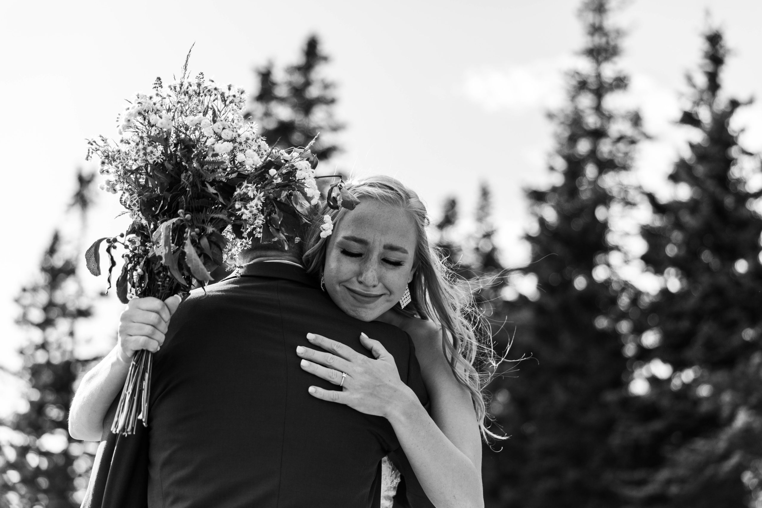 bride and father hugging at aisle