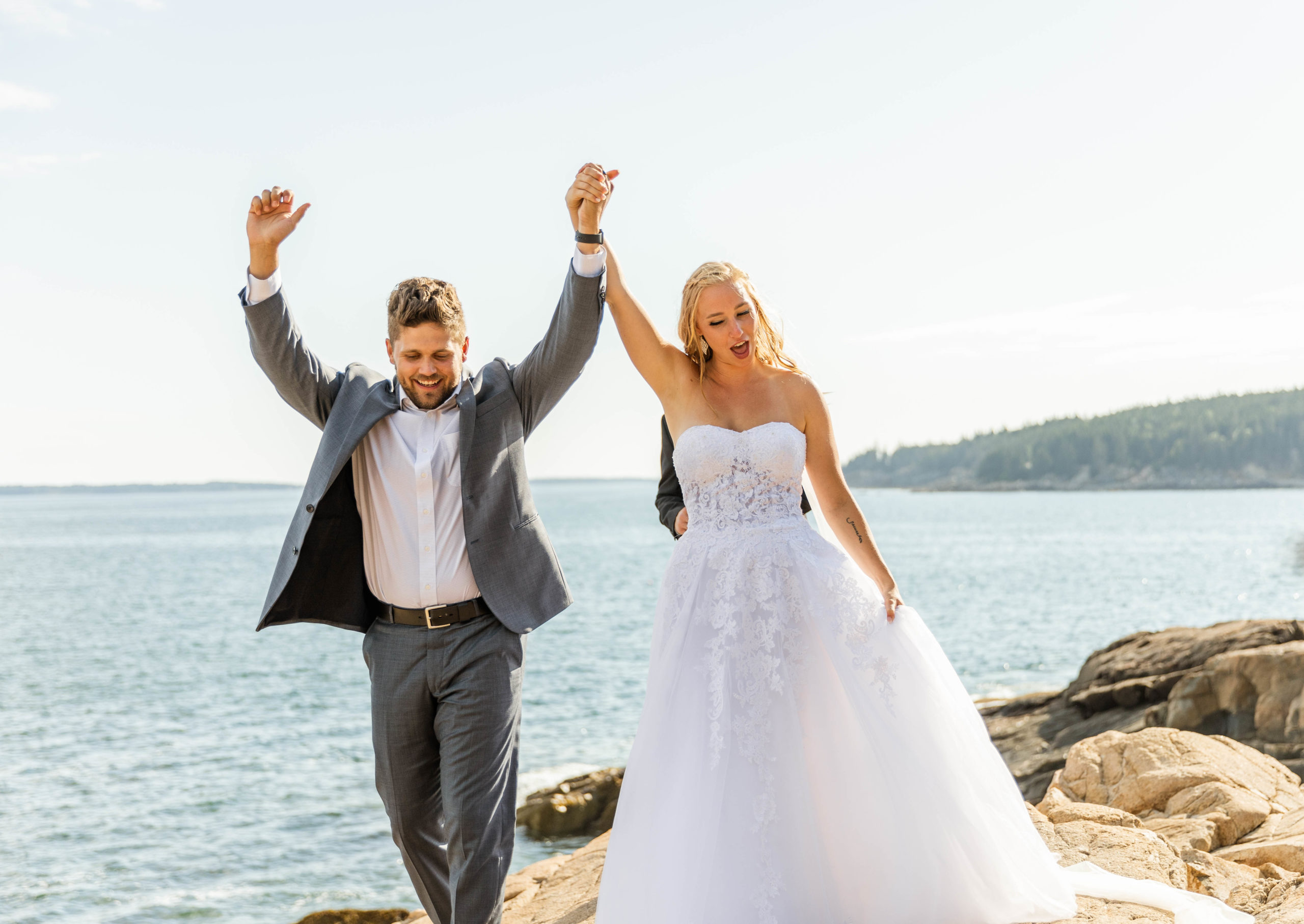 bride and groom ceremony on bluff overlooking ocean at Acadia National Park elopement