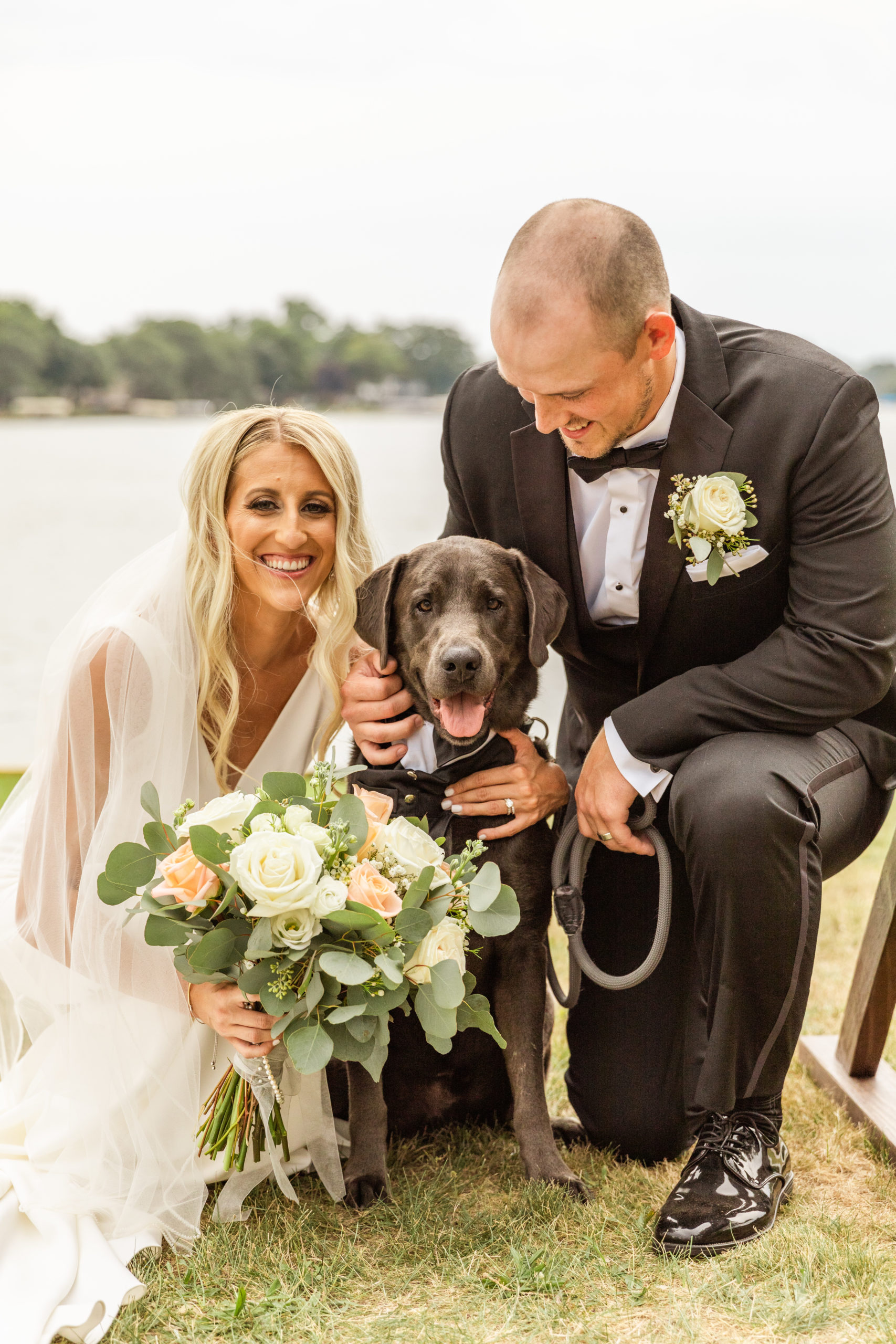 bride and groom with black lab dog in Michigan wedding