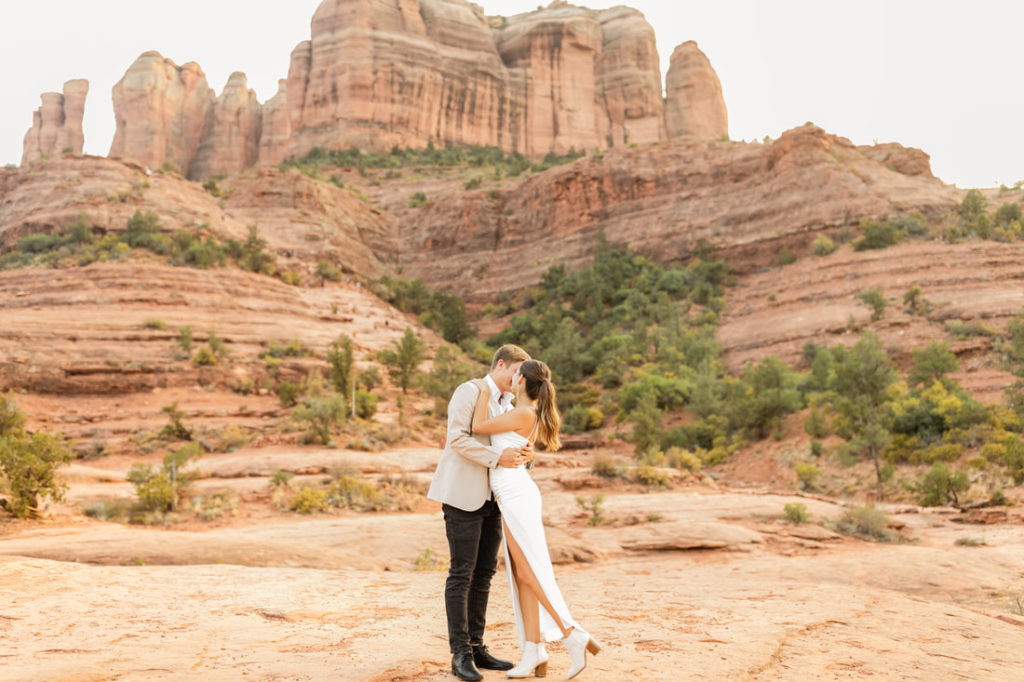 Bride and groom kissing in elopement photos at red rocks national park