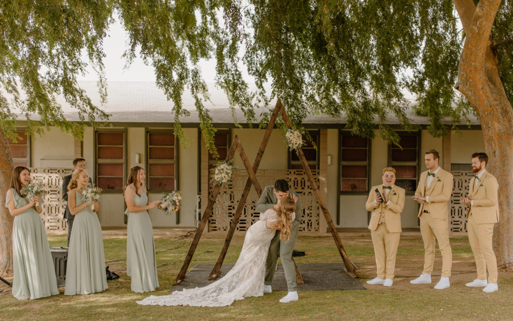 Ceremony First Kiss Wedding Photos outdoor intimate ceremony under willow tree