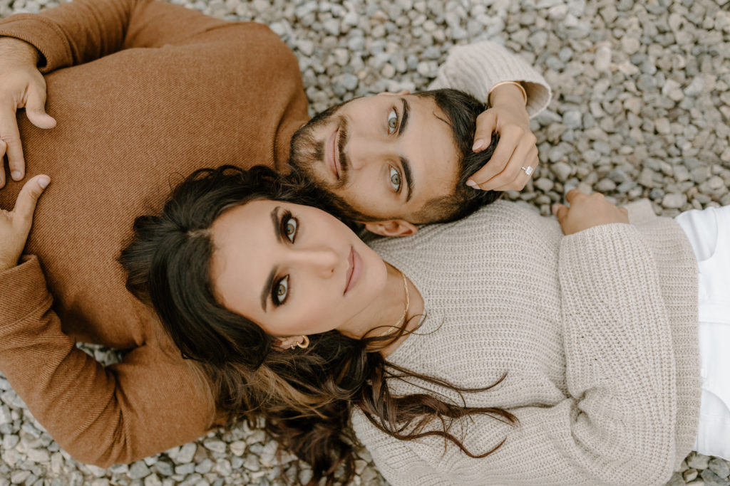 Gravel Yard Mountain Minimalistic Engagement Photos Neutral Outfits Couple with Amber Eyes
