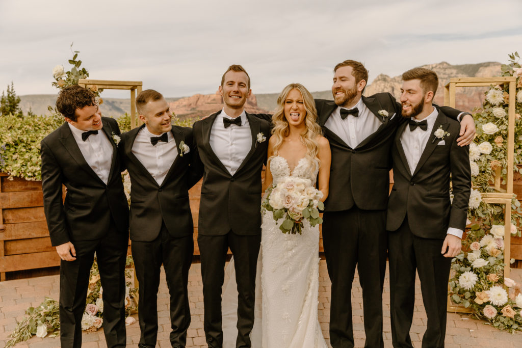 Bride with groomsmen black tux classic bridal party outfits wedding photos