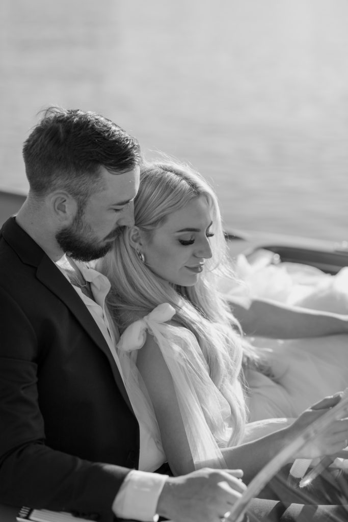 Bride and groom on a boat in the ocean