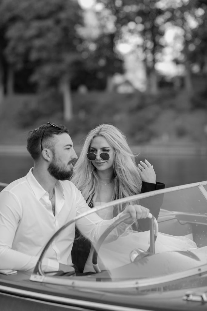 Black and white photography bride and groom on a vintage boat in Lake Michigan Saugatuck