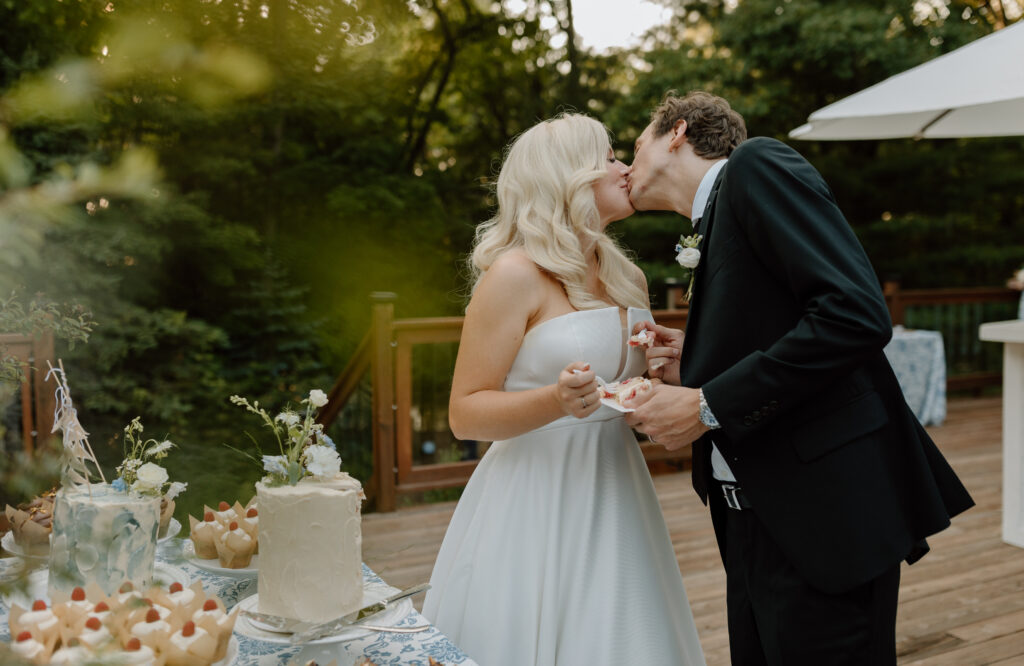 Bride groom cake cutting photos Michigan photographer Leelanau School